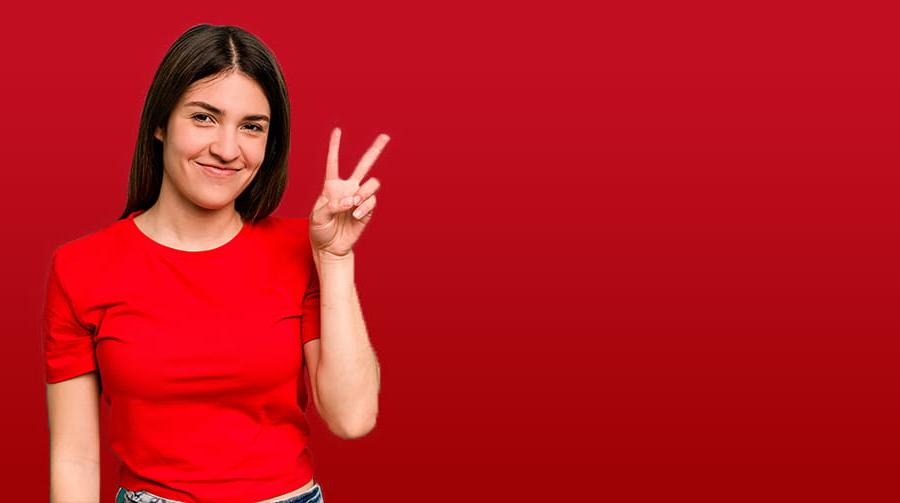 Woman holding up 2 fingers with red background